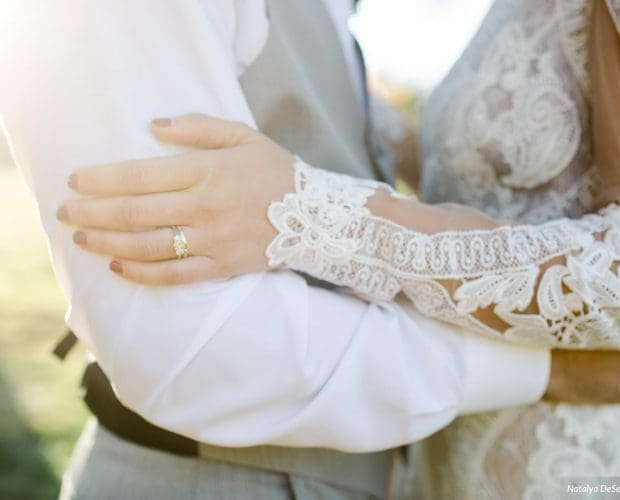 Her Engagement Ring Style - A bride and Groom embrace.